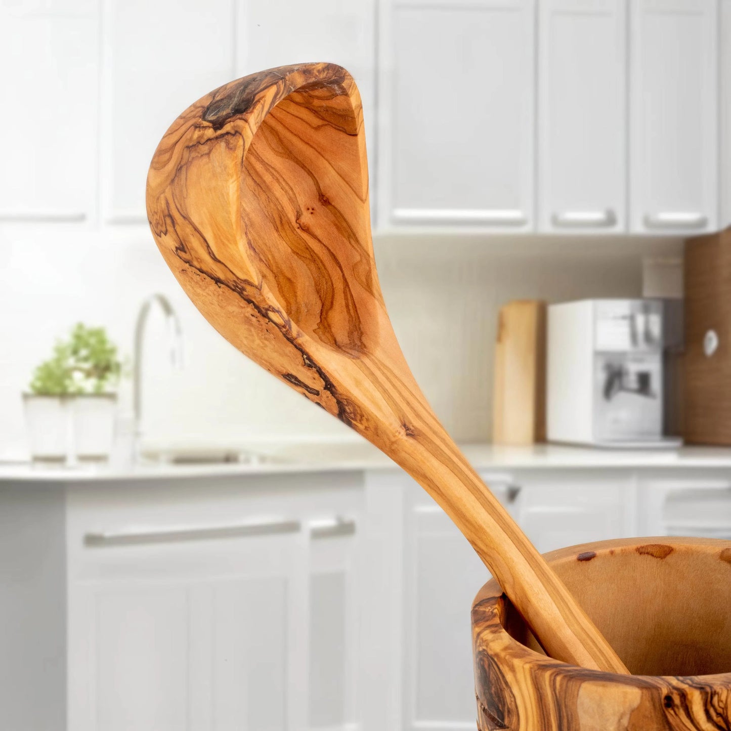Turquoise Lucy handmade olive wood kitchen utensils ladle in modern white kitchen