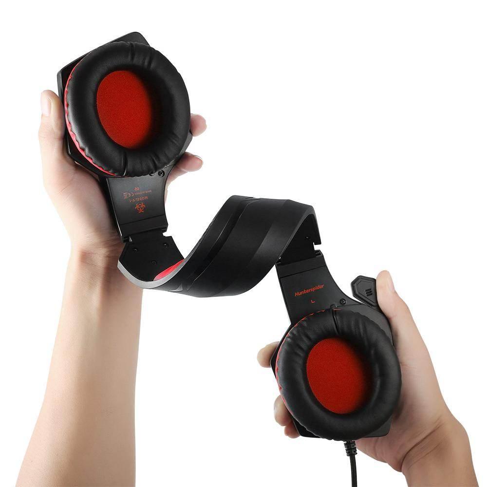 Yellow Pandora premium gaming headset with black and red cushioned ear cups held in hands