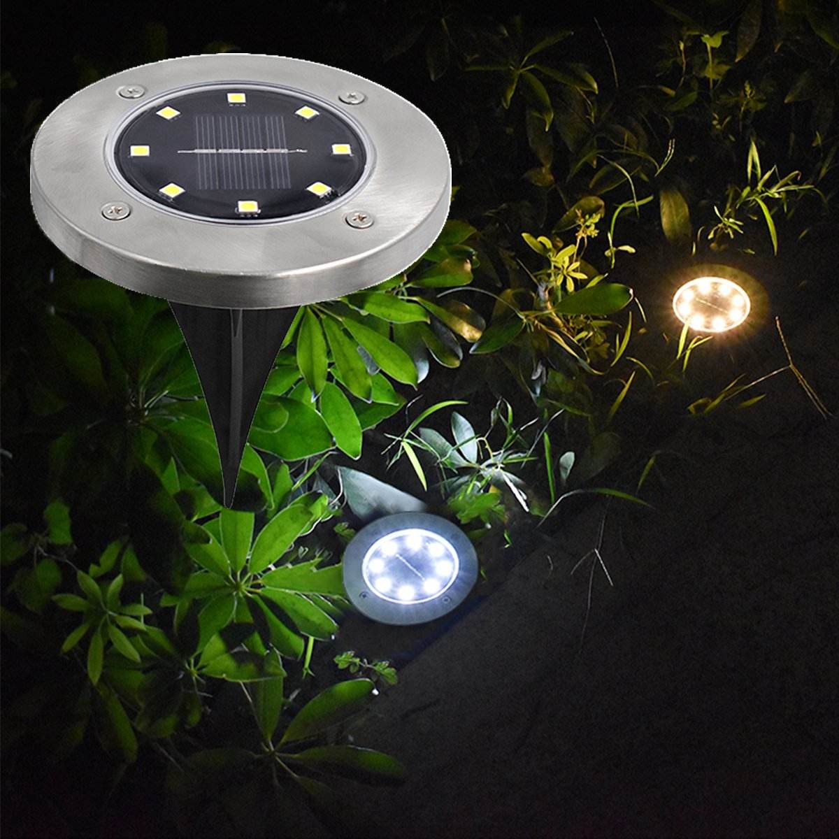 Pink Iolaus solar powered garden pathway lights with stainless steel finish illuminating outdoor plants