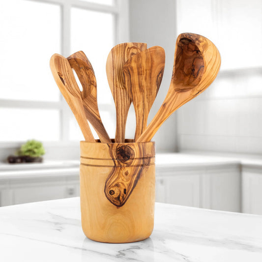 Turquoise Lucy handmade olive wood kitchen utensils set in wooden holder on white marble countertop
